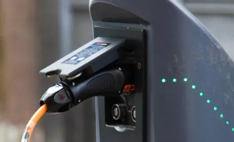 electric car plug plugged in