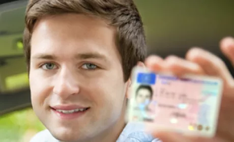 teen holding license